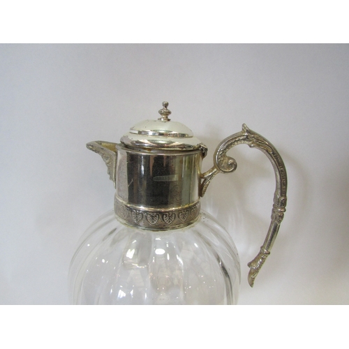 1481 - A silver plated claret jug with melon fluted glass reservoir