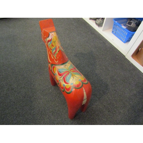 1508 - A Swedish 'Dala' folk art horse, painted in orange and multicolours, 41.5cm high