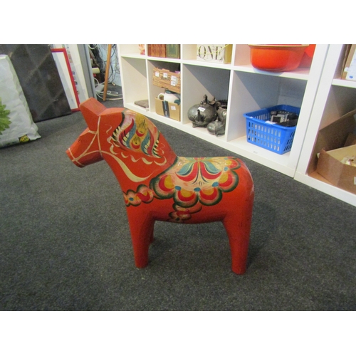 1508 - A Swedish 'Dala' folk art horse, painted in orange and multicolours, 41.5cm high