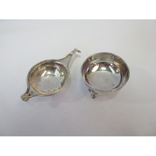 1428 - An Adie Brothers Ltd. silver tea strainer on stand, the two parts stamped Birmingham 1925 and 1933, ... 