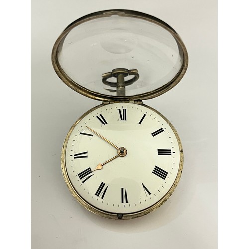 5180 - An early 19th Century silver pair cased pocket watch, enamelled Roman dial with spade hands, verge e... 