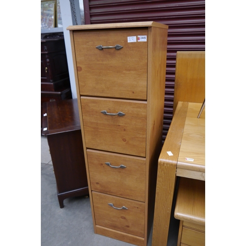 2445 - A modern pine effect four drawer filing cabinet with paper files