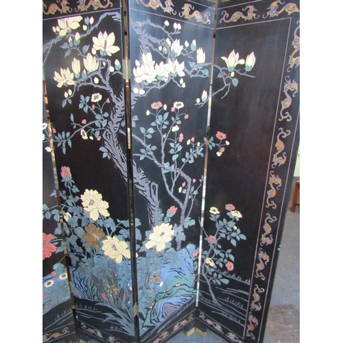 1162 - A lacquered six-fold Oriental screen, apple blossom, birds and flowers. 183cm tall