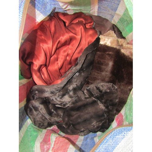 1176A - A bag containing assorted fur coats and stoles