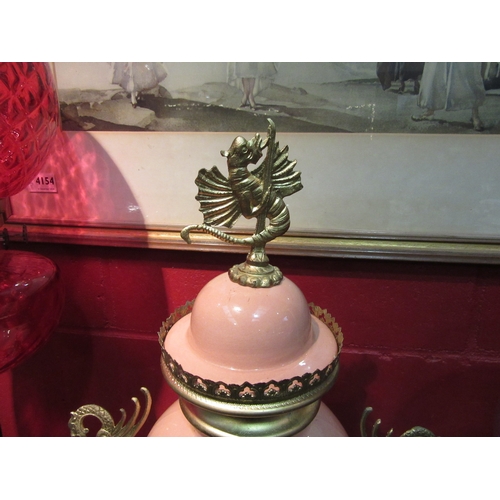 4204 - A late 19th Century mantel timepiece in the form of a rose pink porcelain vase made by DeWinter & Fi... 