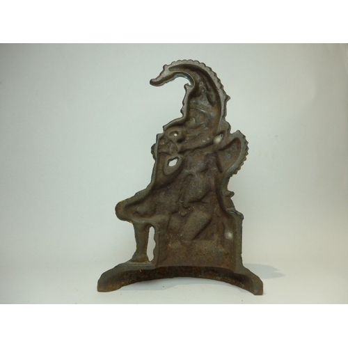 4210 - A 19th Century painted cast iron punch doorstep with dog wearing a top hat, 33cm x 22.5cm