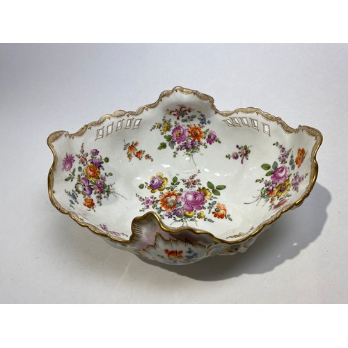 4501 - A German porcelain bowl of Rococo form with handpainted floral sprays throughout, gilt highlights an... 