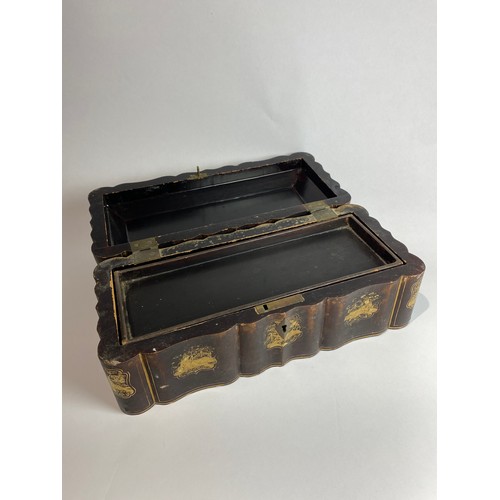 4502 - An early 20th Century Japanese lacquered box of serpentine shape decorated with gilt scenes (areas a... 