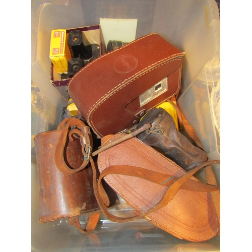 4565 - A box of mixed photographic and optical items including Zenith 10x50 binoculars, opera glasses, Sawy... 