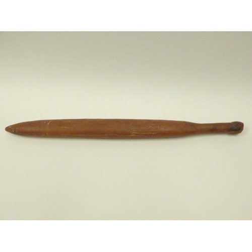 4167 - An Australian carved nalla throwing stick, 59cm long