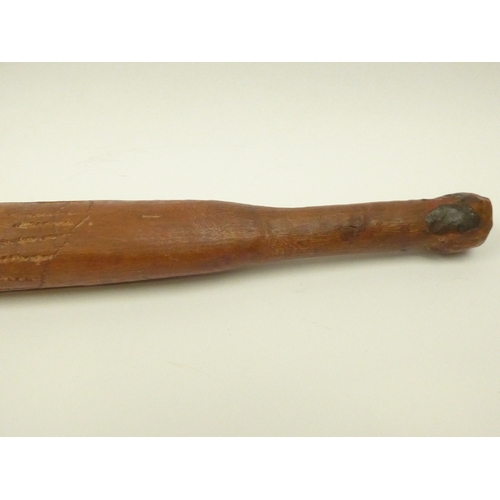 4167 - An Australian carved nalla throwing stick, 59cm long