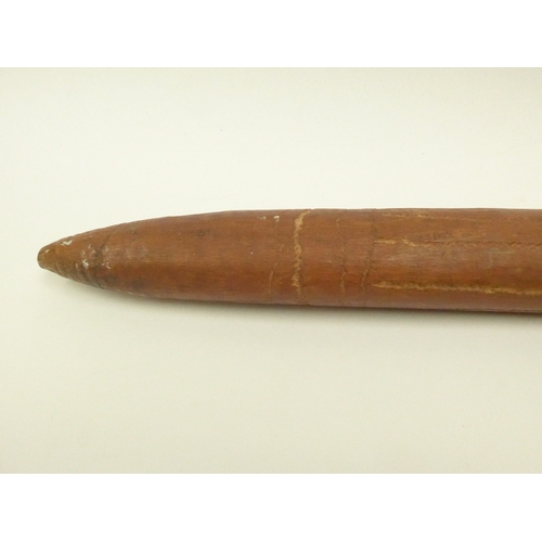 4167 - An Australian carved nalla throwing stick, 59cm long