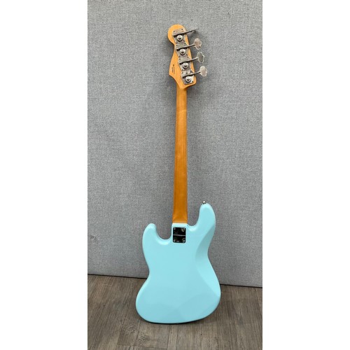 5106 - A Fender Vintera '60s Jazz Bass guitar in Daphne Blue, serial number MX19059412, with tweed style ha... 