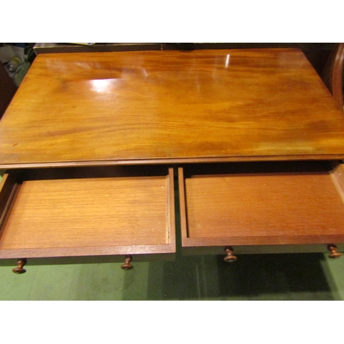 4001 - A circa 1860 flame mahogany side table, the two frieze drawers over a shaped slab end base on turned... 