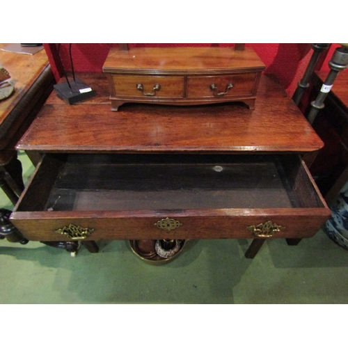 4111 - A circa 1780 provincial oak side table, the plank top over a single frieze drawer on internal chamfe... 