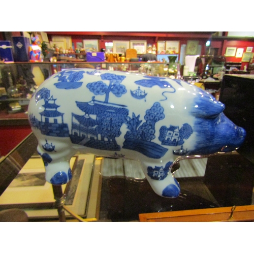 4308 - An Oriental design blue and white ceramic piggy bank money box, 25cm long