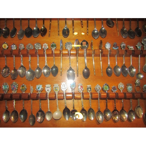 4311 - A mahogany display case containing tourist spoons, with key