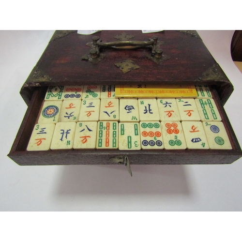 1011 - An early 20th Century bone and bamboo Mahjong set, housed within a fitted case with drawers