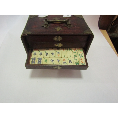 1011 - An early 20th Century bone and bamboo Mahjong set, housed within a fitted case with drawers