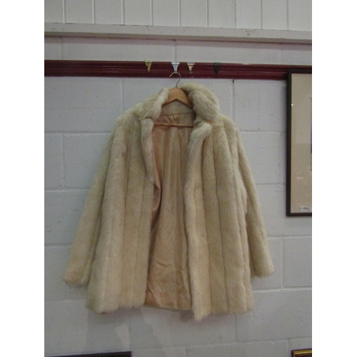 1176A - A bag containing assorted fur coats and stoles