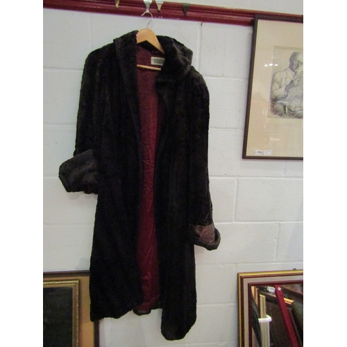 1176A - A bag containing assorted fur coats and stoles