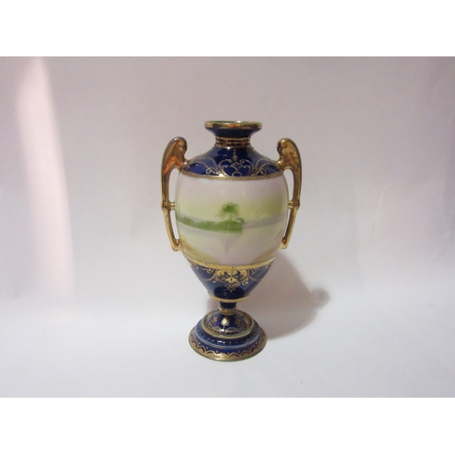 4364 - A Noritake twin handled urn circa 1908, countryside scene, cobalt blue and gilt, 21cm high