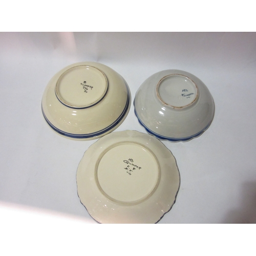 4365 - Three Quimper pottery bowls, one with scalloped rim (some chipping present decorated with man back s... 