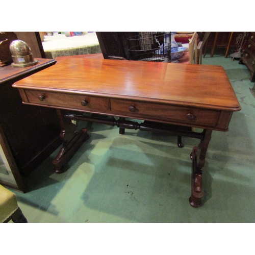 4001 - A circa 1860 flame mahogany side table, the two frieze drawers over a shaped slab end base on turned... 