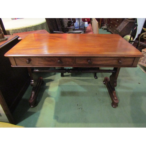 4001 - A circa 1860 flame mahogany side table, the two frieze drawers over a shaped slab end base on turned... 