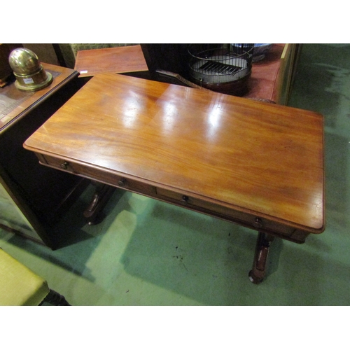 4001 - A circa 1860 flame mahogany side table, the two frieze drawers over a shaped slab end base on turned... 