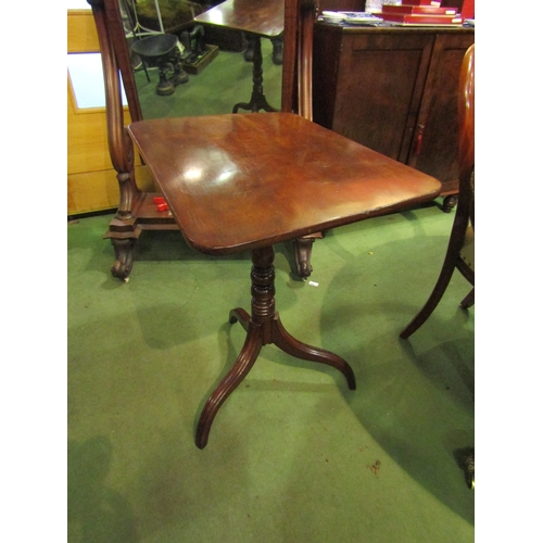 4286 - A George III flame mahogany round cornered tilt-top wine table over a baluster and ring-turned colum... 