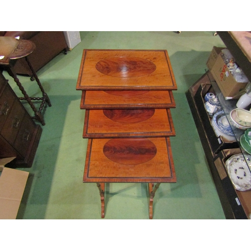 4157 - A quartetto nest of George III revival mahogany graduating occasional tables on ring turned legs and... 