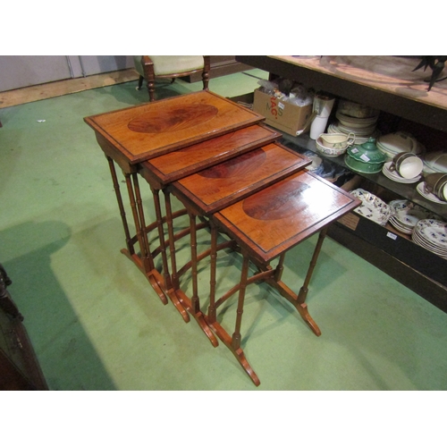 4157 - A quartetto nest of George III revival mahogany graduating occasional tables on ring turned legs and... 