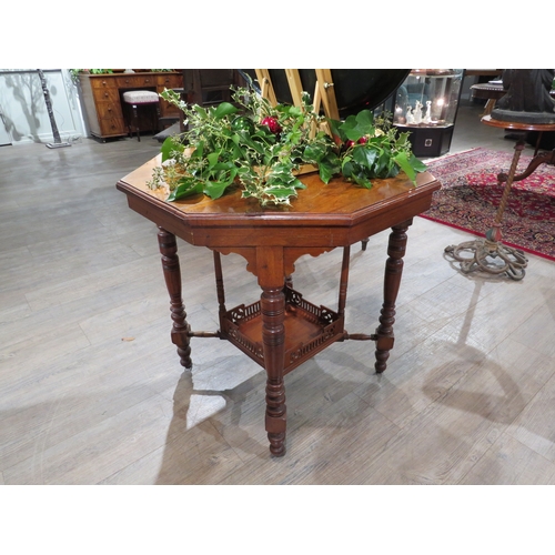 1099 - A Victorian mahogany octagonal table with galleried under tier, 71cm tall, 73cm x 73cm