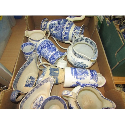 1195 - A box containing an assortment of blue and white china, mainly jugs, coffee pots and sauce boats