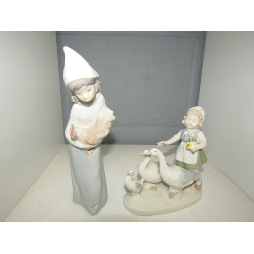 1297 - A Lladro figurine of young girl holding chicken and a similar figure of young girl and three geese, ... 