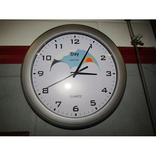 1329 - A battery operated wall clock with sun/moon dial.  24cm dial