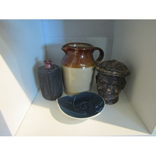 1444 - Decorative ornaments including lidded pot as the head of a boy wearing cap (a/f), stoneware jug, stu... 