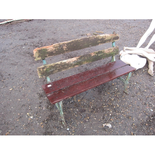 3249 - A cast ended timber slatted garden bench