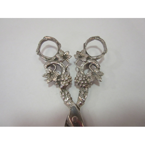 1360 - A pair of white metal grape scissors with grape and vine design, thought to be Dutch, marked HH 90