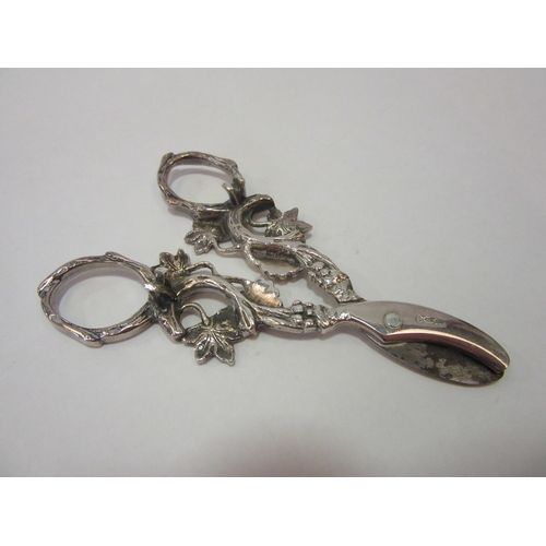 1360 - A pair of white metal grape scissors with grape and vine design, thought to be Dutch, marked HH 90