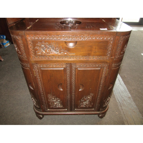 1024 - A Chinese hardwood drinks cabinet with carved scenes, 92cm tall x 37.5cm deep x 76cm wide