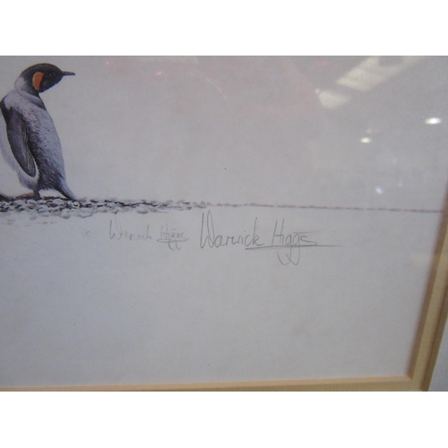 1076 - A pencil signed print of marching penguins after Warwick Higgs.  Framed and glazed.  18.5cm x 50.5cm... 