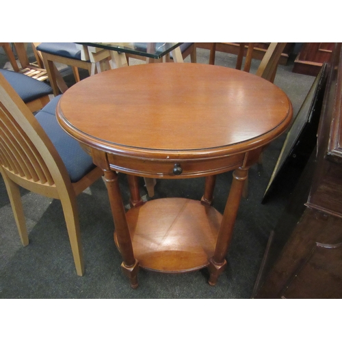 1105 - A pair of oval top two-tier occasional tables, 71cm tall x 54cm x 52cm