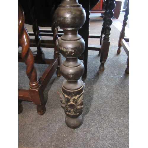 1127 - A Gothic style oak hall table with carved decoration, shaped frieze and turned legs, 88cm tall x 105... 