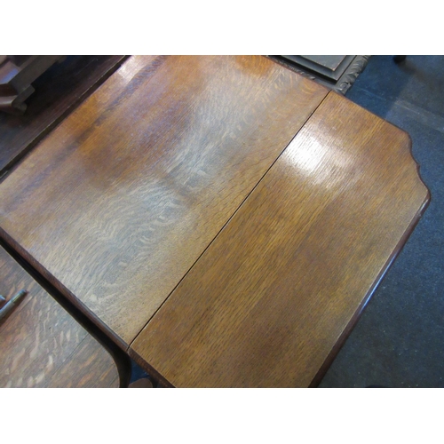 1129 - A 1940's oak full flap table raised on barley-twist supports