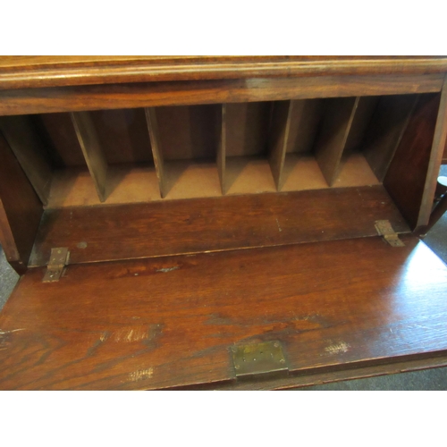 1137 - A circa 1940's oak student's bureau, drop-flap over single drawer, 103cm tall x 75cm wide x 27cm dee... 