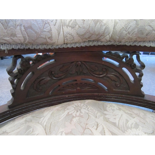 1165 - A pair of early 20th Century tub chairs, spindle rail, button beige upholstery turned supports on po... 