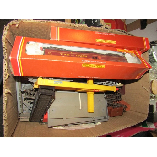 1190 - Two boxes of model railway accessories including Tri-ang and Hornby boxed examples, track, locos, bu... 