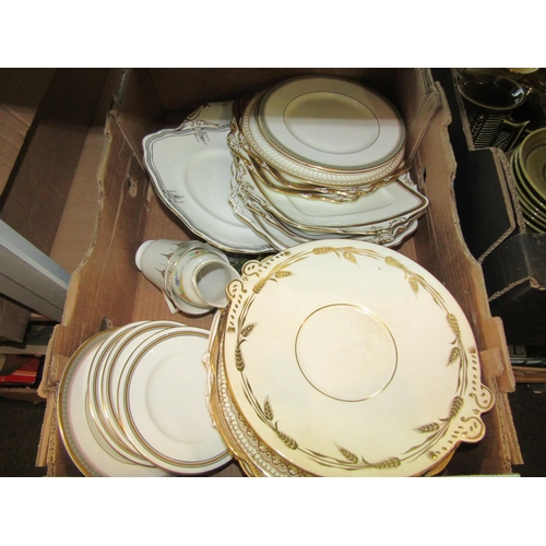 1193 - A box of miscellaneous gilt embellished plates of various sizes to include Paragon, Wedgwood, etc.